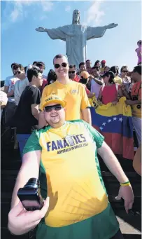  ?? PHOTO: GETTY IMAGES ?? Crowded . . . Australian tourists pose for photos in front of Christ the Redeemer in Rio de Janeiro, Brazil.