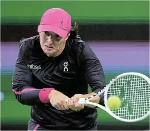  ?? Picture: CLIVE BRUNSKILL/GETTY IMAGES ?? POWER PLAY: Iga Swiatek of Poland plays a backhand against Kazakhstan’s Yulia Putintseva in their fourth-round match at Indian Wells Tennis Garden in California on Tuesday