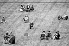  ?? CHARLIE RIEDEL/AP ?? A socially distanced crowd listens to the Kansas City Symphony on Sept. 19 in Missouri.