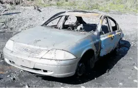  ??  ?? The car was used to do burnouts before it was set alight near a river.
