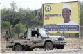  ?? Picture: Reuters ?? Chadian soldiers sit in a parked technical vehicle in front of an election campaign poster for the late president Idriss Déby along a roadside in N’Djamena, Chad, this week. Déby was re-elected after three decades in power, but died in a clash with rebels days before he was to start his new term.