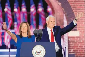  ?? ANDREW HARNIK/ASSOCIATED PRESS ?? Vice President Mike Pence arrives with his wife Karen Pence to speak on the third day of the Republican National Convention in Baltimore on Wednesday.