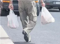  ?? PAUL CHIASSON THE CANADIAN PRESS FILE PHOTO ?? Sobeys Inc.’s move will eliminate 225 million plastic bags used annually across the chain’s 255 stores.