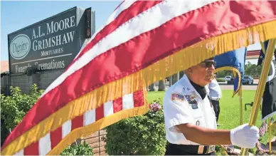  ??  ?? David Carrasco of the POW MIA KIA Honor Guard stands at A.L. Moore-Grimshaw Mortuaries. DAVID WALLACE/THE REPUBLIC