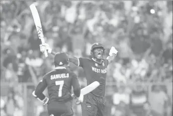  ??  ?? Carlos Brathwaite exults after smashing four consecutiv­e sixes to lead the West Indies to victory over England in the World T20 final in Kolkata, India in April this year.