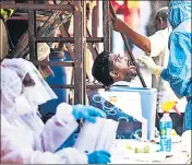  ?? PRATIK CHORGE/HT PHOTO ?? ■
A doctor takes a swab sample of a resident in a Covid-19 testing drive in Dharavi, Mumbai, on May 20.