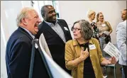  ?? TAMIR KALIFA / AMERICAN-STATESMAN ?? Earl Maxwell (left) and William Buster of St. David’s Foundation chat with Trish van Til, of the Interagenc­y Support Council of Eastern Williamson County, after the awards on Wednesday.