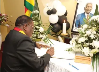  ?? ?? President Mnangagwa signs the book of condolence at the Tanzanian Embassy in Harare yesterday following the passing on of former President of the United Republic of Tanzania, Ali Hassan Mwinyi, recently.
— Picture: Innocent Makawa