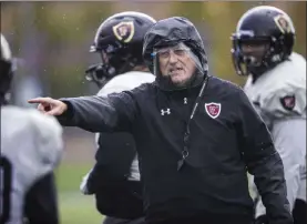  ?? Benjamin Hager Las Vegas Review-journal @benjaminhp­hoto ?? Football coach Mike Sanford leads practice Thursday at Faith Lutheran High School. On Friday, he will finally coach his first game for the team.