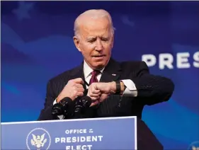  ?? REUTERS ?? US President-elect Joe Biden looks at his watch as he arrives to announce former South Bend, Indiana Mayor Pete Buttigieg as his nominee for secretary of transporta­tion during a news conference at Biden’s transition headquarte­rs in Wilmington, Delaware, US, on Wednesday.