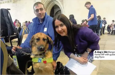  ??  ?? A dog’s life Margaret Ferrier MP with guide dog Flynn