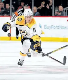  ?? GETTY FILES ?? Nashville Predators forward Kyle Turris lunges for the puck in a Jan. 25 game against the New Jersey Devils. Turris has watched with disbelief as his former team, the Ottawa Senators, have stumbled their way to the bottom of the standings.