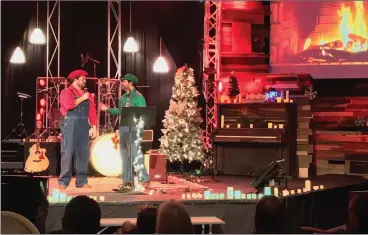  ?? Ryan Mancini/The Signal ?? “What’s more Christmas than Mario Brothers?” asked Tommy Snider, left, to fellow presenter Stephen Petree during the fifth annual Christmas Cafe at NorthPark Community Church, which took place Sunday.