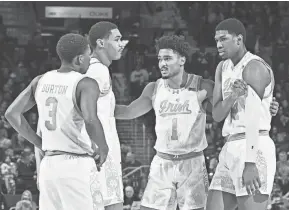  ?? MATT CASHORE/USA TODAY SPORTS ?? The Fighting Irish huddle in the second half during Saturday’s home loss to Duke.