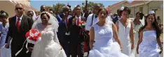  ?? TRACEY ADAMS African News Agency (ANA) ?? Eleven couples tied the knot at the annual Valentine’s Day weddings at Robben Island’s Garrison Church yesterday. |