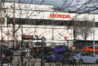  ?? Adrian Dennis / AFP / Getty Images ?? The Honda manufactur­ing plant in Swindon, England, will be closed in 2021, eliminatin­g 3,500 jobs, the Japanese car maker said, citing industry changes and economic headwinds in Britain.