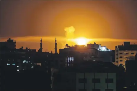  ?? AFP ?? An explosion in Gaza City after an air strike by Israeli forces on Saturday