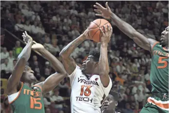  ?? MICHAEL THOMAS SHROYER, USA TODAY SPORTS ?? Virginia Tech, with Ahmed Hill (13), and Miami (Fla.), with Ebuka Izundu (15) and Davon Reed (5), are Atlantic Coast Conference rivals that could be dangerous teams in March.