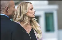  ?? JEENAH MOON / THE NEW YORK TIMES ?? Stephanie Clifford, the porn star better known as Stormy Daniels, speaks to reporters outside a federal courthouse April 16 in New York. President Donald Trump has a history of attacking women who have made accuations against him, like Clifford, and mocking their bodily functions, demeaning their looks or comparing them to animals. Trump referred to Clifford as “Horseface” in a tweet.