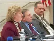  ?? EVAN BRANDT — DIGITAL FIRST MEDIA ?? Boyertown Area School Board members Clay Breece, right, and Robert Caso, center, listen while board member Jill Dennin addresses the board Tuesday night.