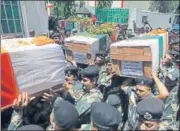  ?? AFP ?? Indian Border Security Force officers carry the coffins of their slain colleagues at the BSF headquarte­rs in Jammu on Wednesday.
