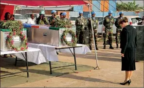  ??  ?? AP
Hilde Johnson of Norway, U.N. special representa­tive and head of the U.N. Mission in South Sudan, pays her respects Saturday in Juba, South Sudan, at the caskets of two peacekeepe­rs from India who were killed Thursday in a rebel attack on their...