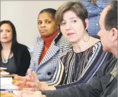  ?? Ned Gerard / Hearst Connecticu­t Media ?? Connecticu­t Institute for Refugees and Immigrants President Claudia Connor leads a meeting with two Syrian Refugee families who settled in the Bridgeport area in 2017.