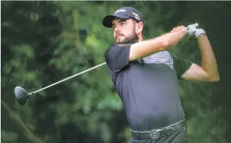  ?? ALEX SLITZ, LEXINGTON HERALD-LEADER ?? Troy Merritt keeps an eye on his drive on the eighth hole during the rain-delayed final round of the Barbasol Championsh­ip in Nicholasvi­lle, Kentucky, on Monday.