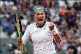  ?? PETR DAVID JOSEK — THE ASSOCIATED PRESS ?? Jelena Ostapenko clenches her fist after winning a point against Caroline Wozniacki during their quarterfin­al match of the French Open in Paris on Tuesday.