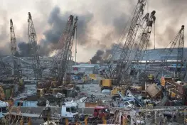  ?? (AP Photo/Hassan Ammar) ?? Aftermath of a massive explosion is seen in in Beirut, Lebanon, Tuesday, Aug. 4, 2020. Massive explosions rocked downtown Beirut on Tuesday, flattening much of the port, damaging buildings and blowing out windows and doors as a giant mushroom cloud rose above the capital. Witnesses saw many people injured by flying glass and debris.