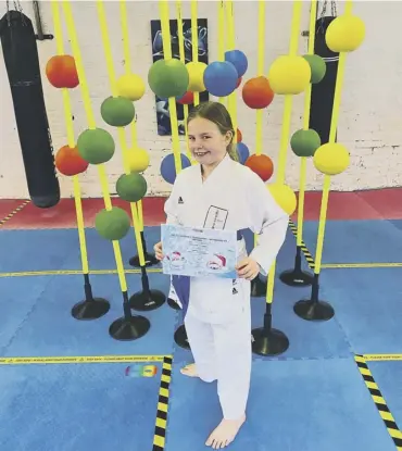  ??  ?? SKY’S THE LIMIT: Starlet Skyla Handley enjoyed success in her internatio­nal karate debut.