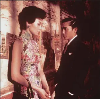  ?? 2000 USA FILMS — ONLINE USA/HULTON ARCHIVE/GETTY IMAGES/TNS ?? Maggie Cheung, left, and Tony Leung in the movie “In the Mood for Love.”