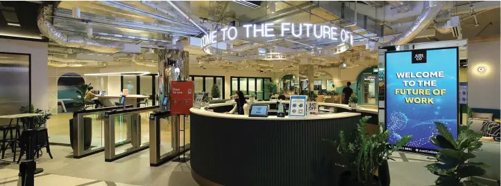  ?? PICTURES: SAMUEL ISAAC CHUA/THE EDGE SINGAPORE ?? JustCo’s smart tech-enabled workspace at The Centrepoin­t boasts features such as a robotic cafe and access via facial recognitio­n