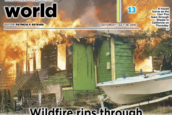  ?? AP ?? A house burns as the Carr Fire tears through Shasta in California on Thursday.