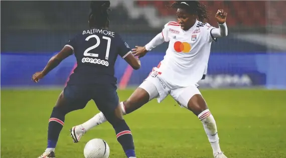  ?? FRANCK FIFE / AFP / FILES ?? Kadeisha Buchanan fights to keep the ball from Paris Saint-germain midfielder Sandy Baltimore in a French Women's D1 football match in November.