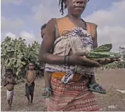  ??  ?? Many rivers have dried up in southern Madagascar, making crops wither. Fideline, left, preparing cactus pads for her family’s daily meal.