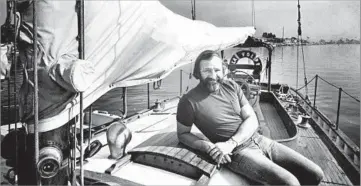  ?? Maxine Reams
Los Angeles Times ?? TARGETED BY AUTHORITIE­S Jailed in Mexico for 17 months on suspicion of drug traffickin­g until a judge cleared him, Pete Dupuy relaxes on
his schooner, La Volpe, in Newport Harbor in 1976. He later ran a commercial fishing operation in Ventura.