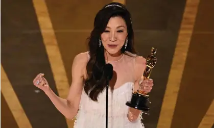  ?? Photograph: Patrick T Fallon/AFP/Getty Images ?? Michelle Yeoh accepts the Oscar for best actress in a leading role for Everything Everywhere All at Once, in March. The academy has announced sweeping rules changes around campaignin­g for nomination­s.