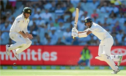  ?? AP ?? Australia’s Aaron Finch takes evasive action as Indian batsman Cheteshwar Pujara plays forcefully to the on side at the MCG yesterday.