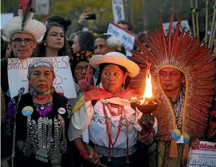  ?? AP ?? Indigenous peoples from Latin America gather with thousands of other demonstrat­ors before marching in Madrid on the sidelines of a United Nations climate summit.