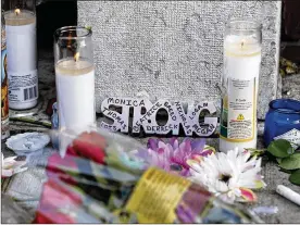  ?? TY GREENLEES / STAFF ?? Memorials to the Dayton shooting victims filled the sidewalks of the Oregon District on Monday morning in the wake of the mass shooting that killed nine people and injured dozens more early Sunday morning.