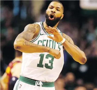  ?? GETTY IMAGES ?? Boston’s Marcus Morris celebrates after hitting a basket against the visiting Cavaliers during the first quarter on Sunday at TD Garden. The Celtics scorched the Cavs 108-83.