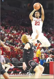  ?? Craven Whitlow/Special to the News-Times ?? Taking aim: Arkansas' C.J. Jones goes up for a shot during the Razorbacks' SEC contest against South Carolina in Fayettevil­le earlier this month. The Razorbacks host Texas A&M today.