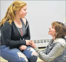  ?? SAM MACDONALD/THE NEWS ?? Hanna Conroy listens to the lamenting of Mary Gillis, rehearsing a scene from Shakespear­e’s Romeo and Juliet at the New Glasgow Youth Theatre Society’s new studio in the basement of the New Glasgow Gymnastics Club.