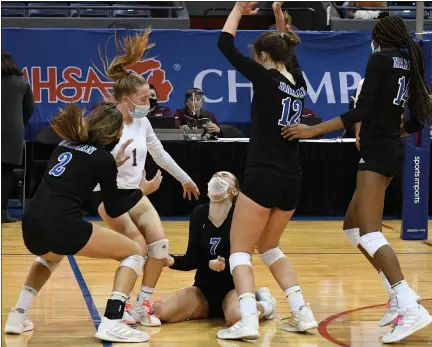  ?? PHOTOS BY DREW ELLIS — MEDIANEWS GROUP ?? Birmingham Marian celebrates after scoring match point to defeat Clarkston in a Division 1volleybal­l semifinal at Kellogg Arena on Friday. The Mustangs won by scores of 22-25, 25-18, 11-25, 25-21, 15-11.