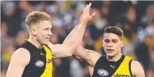  ??  ?? Former Suns and now Tigers Josh Caddy and Dion Prestia.