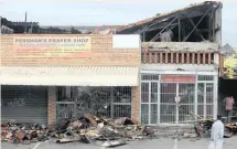  ?? | DOCTOR NGCOBO
African News Agency (ANA) ?? SEVERAL shops near Bangladesh Market in Chatsworth were looted and torched on Monday night. The business owners said their stores had been closed since late last month in accordance with the lockdown regulation­s.