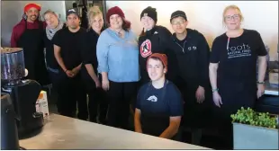  ?? DANIELLE RAY — SENTINEL &
ENTERPRISE ?? Part of the friendly Roots crew, including chef Kevin Williams (far left) and owner Marieke Cormier (second from left), on Valentine’s Day when the cafe side of the popular Leominster health centered spot reopened after being closed for three years.