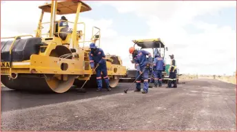  ?? - Picture by Memory Mangombe ?? Staff from the Zimbabwe National Roads Administra­tion (ZINARA) get down to work on the Harare-Mutare Highway yesterday as President Mnangagwa’s road rehabilita­tion programme moves into overdrive.
