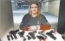  ?? CHARLES REX ARBOGAST/AP ?? Kat Ellsworth, who heads the Liberal Gun Owners club in Illinois, says she is appalled by those who have converged on protests and are openly carrying firearms.